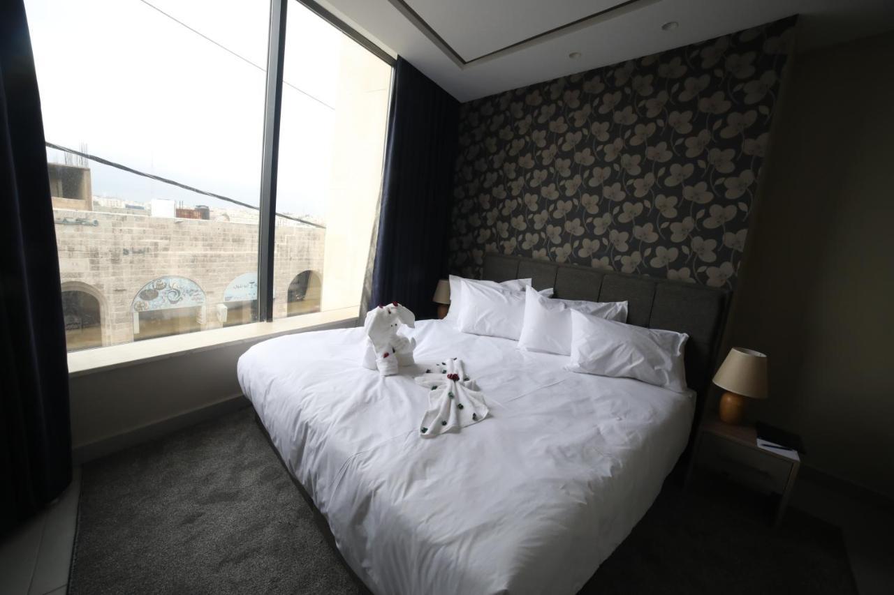 فندق صحارى الخليج Sahara Gulf Hotel Apartments Amman Bagian luar foto