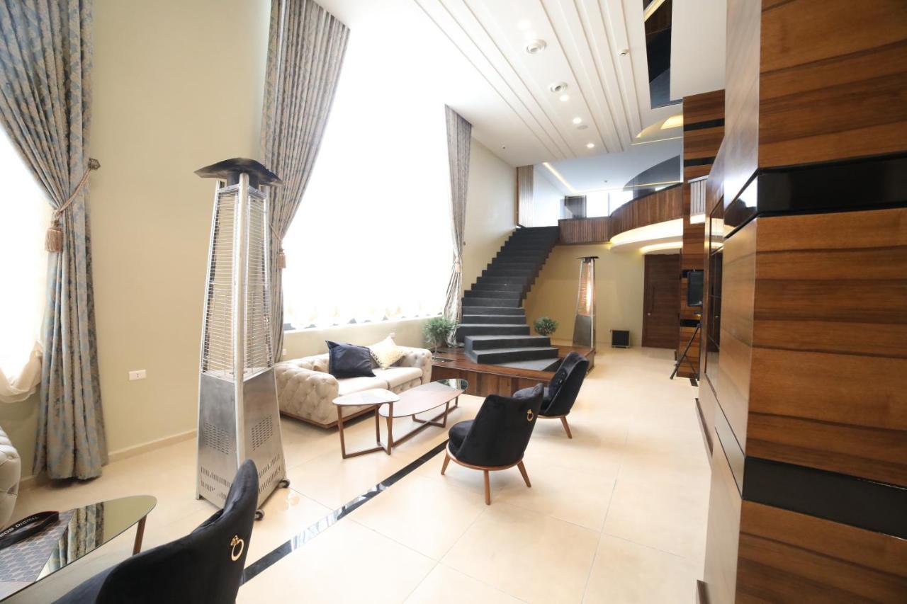 فندق صحارى الخليج Sahara Gulf Hotel Apartments Amman Bagian luar foto